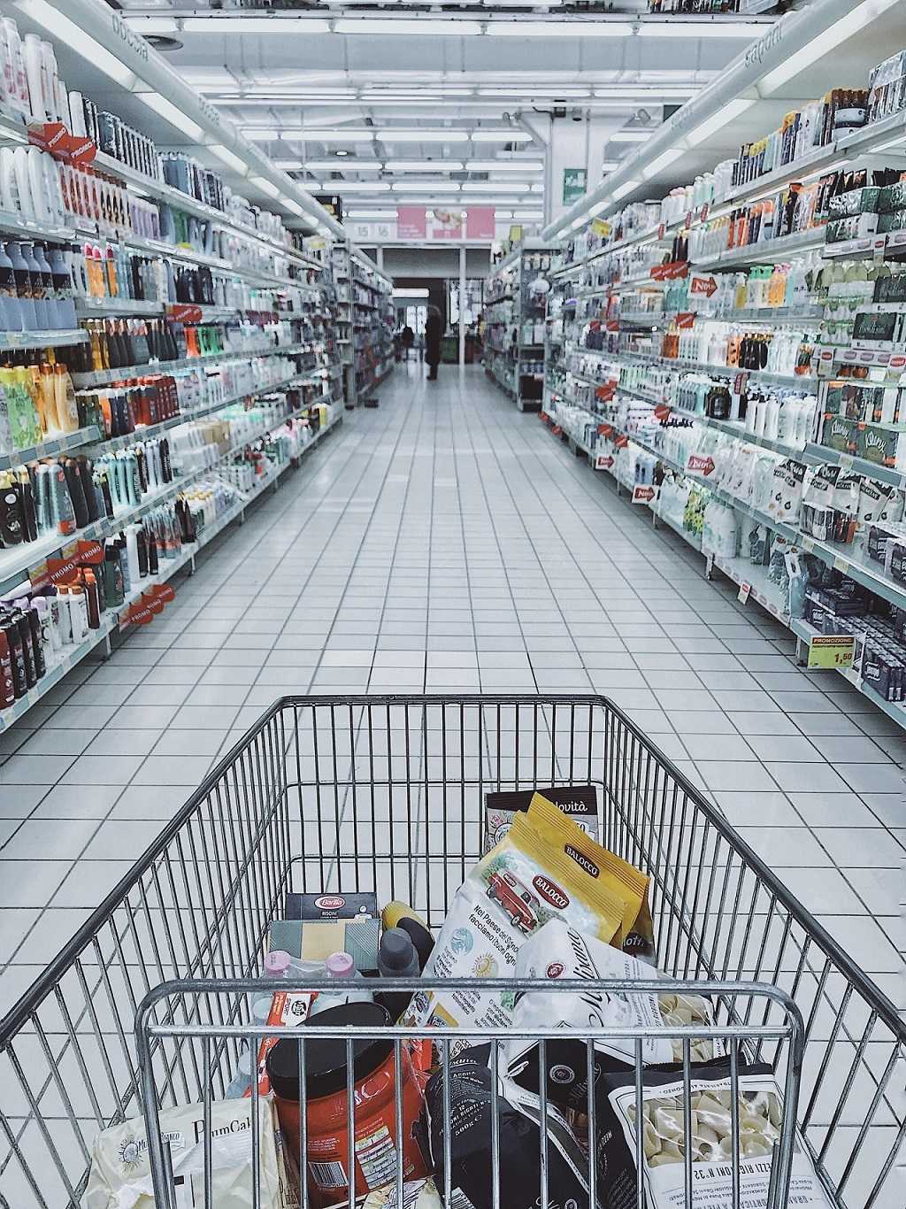 shopping cart in supermarket aisle