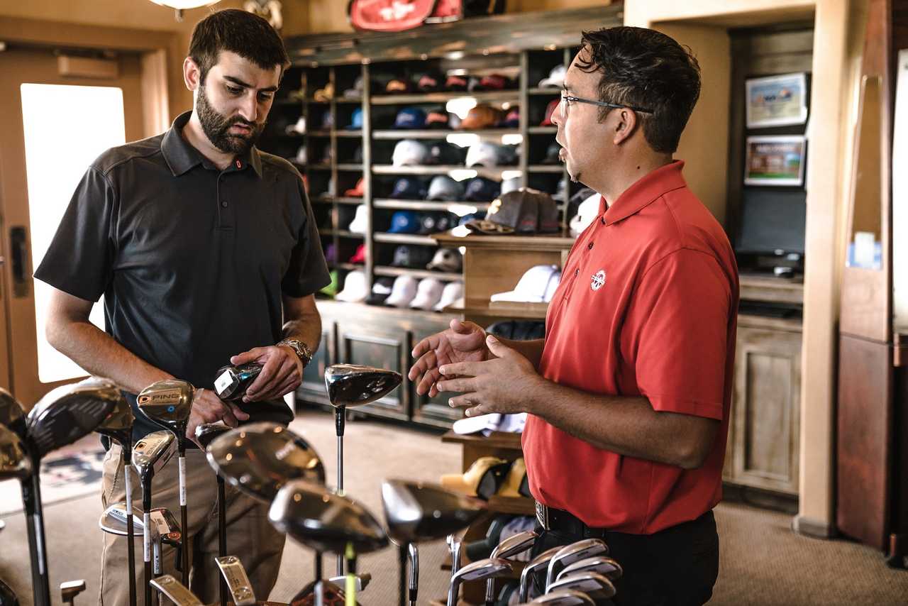 gold shop assistant helping customer